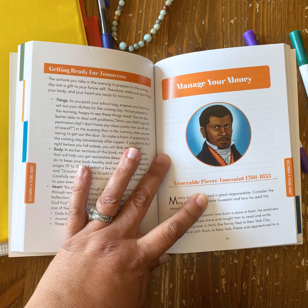 Open book with a portrait of a person on a wooden surface