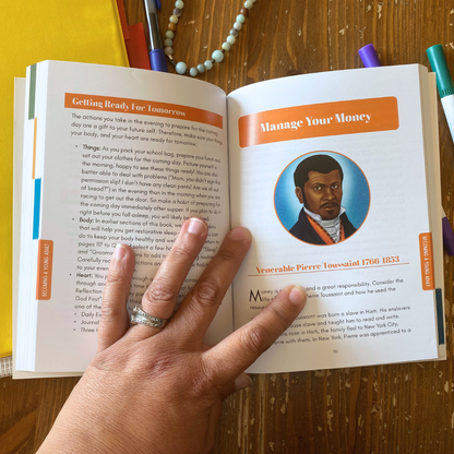 Open book with a portrait of a person on a wooden surface