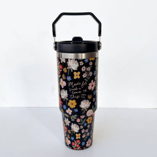 Floral-patterned tumbler with black lid on a white background