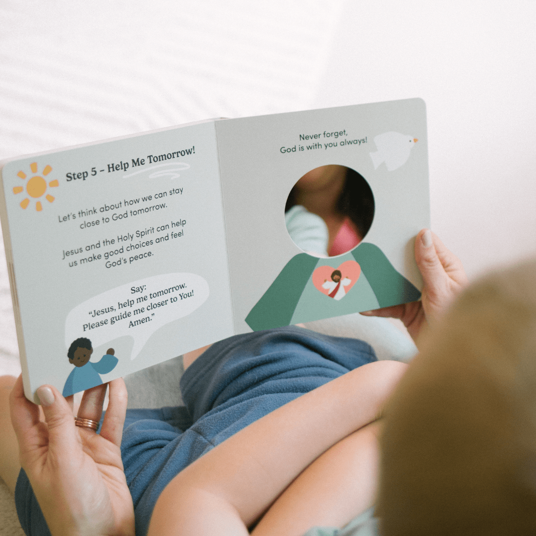 Person reading a children's book with educational content on a light background