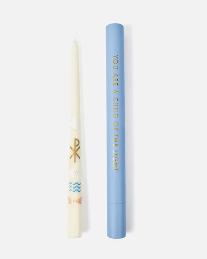 Candle and blue cylindrical container with text on a white background