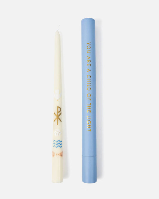 Candle and blue cylindrical container with text on a white background