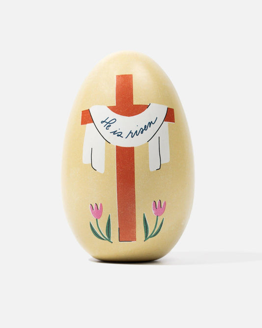 Decorative Easter egg with a cross and text on a white background