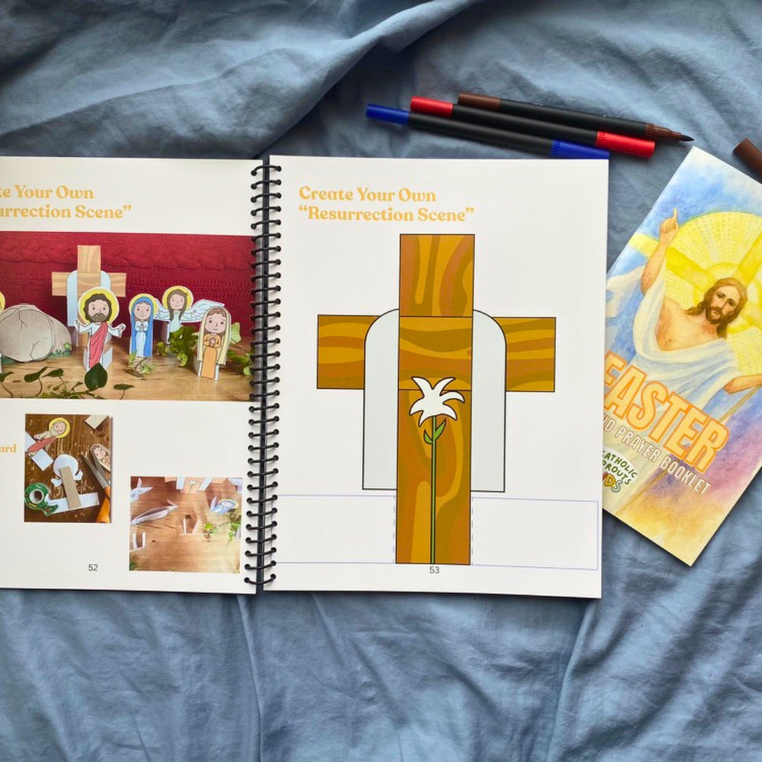 Open book with Easter-themed illustrations on a blue fabric background