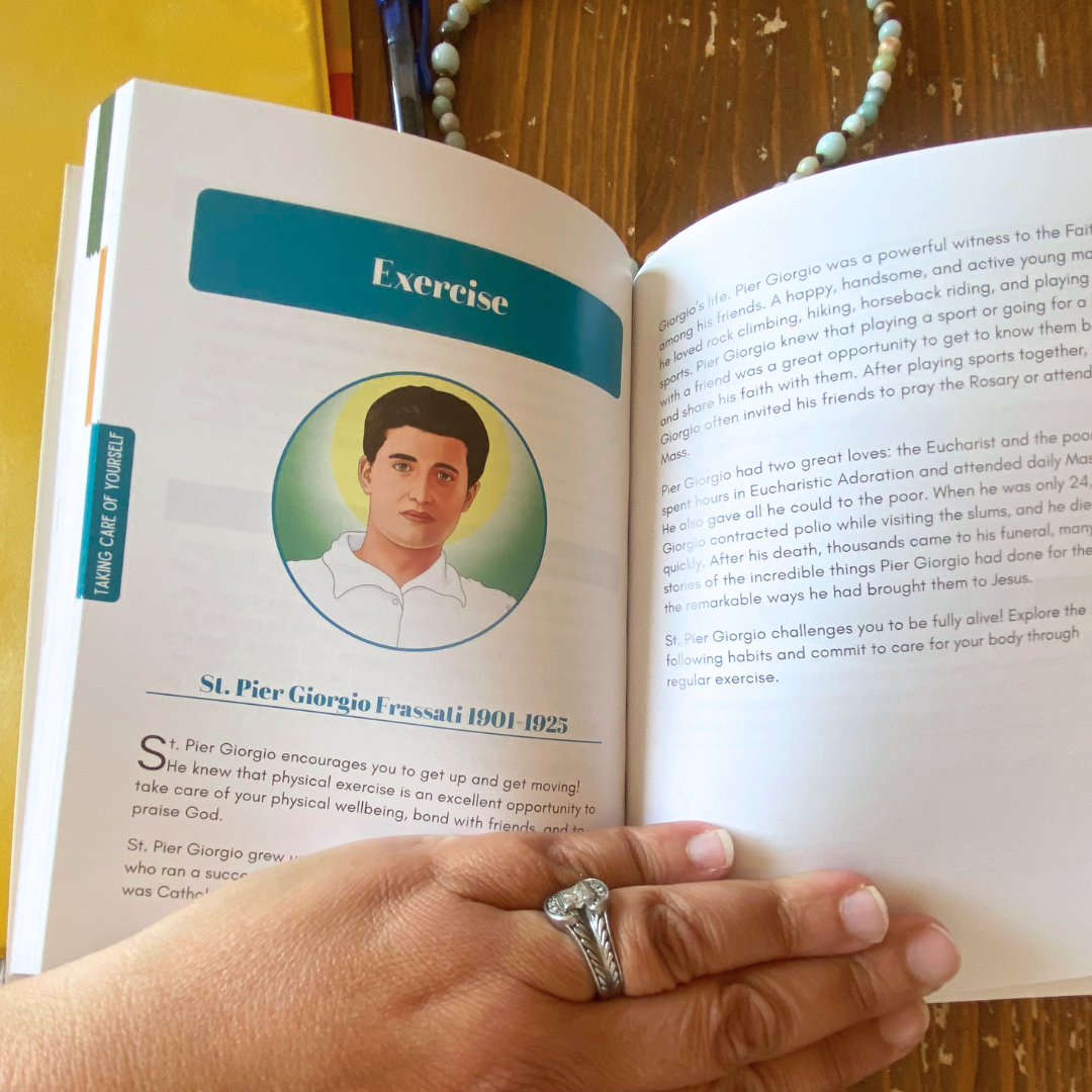 Open book with a portrait of a man and text, held by a hand with a ring.